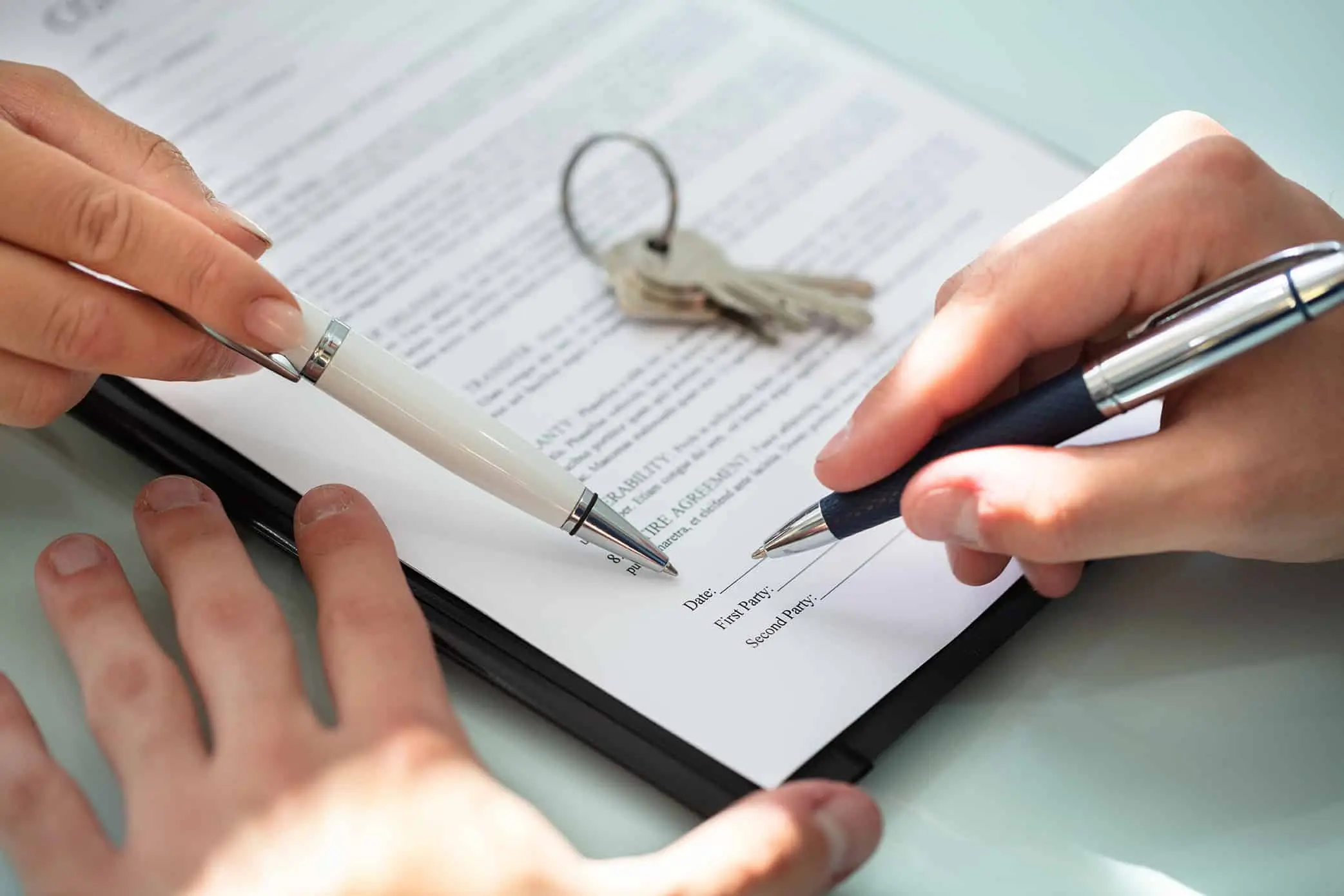Employee reviewing a contract of employment setting out the implied duty of fidelity